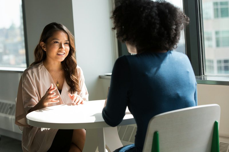 Two Vaultora Group representatives in a genuine face-to-face conversation